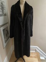 Front view of full-length mink coat on dress form