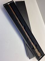 Full view of the Ron Weasley wand inside its original black foam-lined gift box measuring approximately 13 3/4 inches.