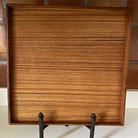 Full top view of the square teak tray with visible wood grain and 3/4" raised rim on all sides.