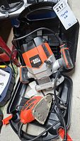 Black and Decker router RP250-CA and palm sander MS500 side by side with power cords visible.