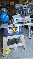 Front view of Ryobi table saw on folding stand showing overall condition