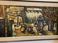 Close-up of the still life composition showing the coffee pot, cup on saucer, and fruit bowl with grapes and citrus fruits on a pedestal.