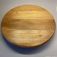 Top view of vintage wooden lazy Susan showing natural wood grain and circular shape.