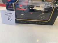 Boxed Liberty Classics Collectible diecast model car in 1:43 scale, black vintage convertible style.