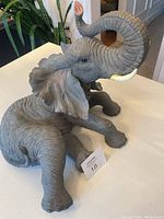 Elephant statue figurine on countertop with detailed texture and features visible from front angle.