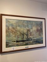 Framed oil painting hanging on a wall showing ships and cloudy sky maritime scene.