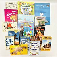 Photo showing 16 children's books including Sammy The Seal, The Tooth Book, Bear Shadow, and others.