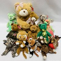 Front view of large collection of assorted TY Beanie Babies and plush bears in different colors and styles