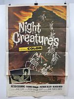 Night Creatures poster hanging on white wall, skeleton horsemen with orange sky and film text