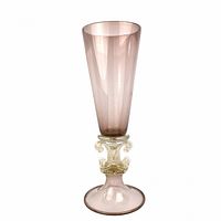 Full view of the tall purple Murano glass vase with gold flecks, scrollwork stem and footed base.