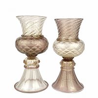 Two Murano Gabbiani glass goblets in clear and purple glass with gold flecks and applied medallions.