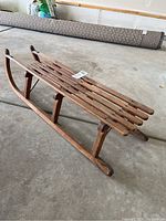 Side angle view showing full length of vintage sled and construction details.