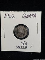 Front side of 1902 Canadian silver nickel coin showing the profile of the royal figure and details of the coin.