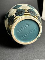 Bottom view showing teal and black vase with number 111/45 and 'Germany' mark