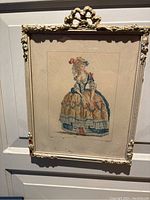 Full view of antique French print in painted carved wood frame with ribbon crown