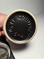 Bottom of coffee press showing Le Creuset branding and size mark '3-4'.