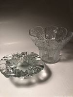 Two pieces by Pertti Kallionen including a textured clear glass vase with cow parsley botanical embossing and a thick clear glass bowl with ruffled edges