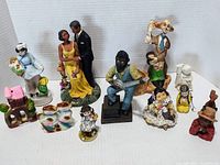Full view of all ten assorted ceramic and vintage Japanese knick knacks figurines arranged together.