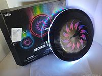 Photo of the LED flying disc frisbee with original packaging showing swirl design and age recommendation of 6+