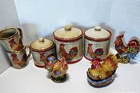 Lot of 12 rooster-themed items including canisters, mugs, and figurines arranged together