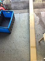 Long cardboard box containing the new 3 piece 18 foot residential steel flagpole kit.