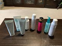 Full lot on table showing all 8 items: 3 Innisfree facial foam tubes, 2 Avene thermal spring water bottles, Innisfree Bija Cica Skin, Candy lotion, and cleaning gel.