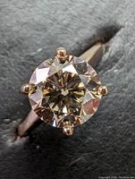 Close-up front view of ring with diamond solitaire