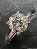 Top-down view of the solitaire ring showing the diamond and prong setting