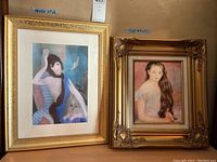 Two pieces of framed and signed art showing a woman in a blue garment and a young girl, both signed by Marie Laurencin.
