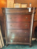 Front view of four drawer dresser with ring pull hardware