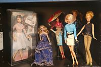 Photo showing all 7 dolls including boxed Barbie Look doll and 6 dolls with varied outfits