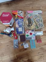 Overview of all miscellaneous items in the lot including boxed kits, vases, tapes, and tools