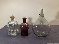 All three decanters shown together on table.