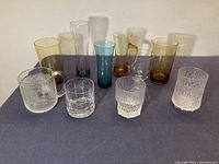 Overview photo showing all 10 pieces of mixed Scandinavian glasses with varied textures and colors.