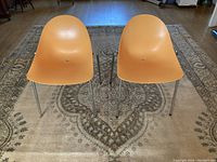 Front view of both chairs on rug