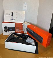 ANOVA Precision Cooker and vacuum sealer in original packaging with user manual and accessories visible