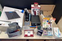Overview of all items including personal scale, foot spa, grooming kits and grooming accessories arranged on a table to show entire lot