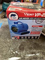 Photo of B-Air Vent VP-25 air mover fan in original box showing front and labeling