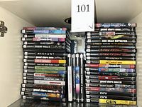 Two stacks of PS2 game cases showing various titles