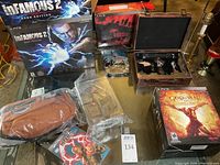 Overall view of three PS3 collector edition boxes and accompanying accessories