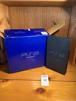 Sony PlayStation 2 console boxed version with blue retail box and console case