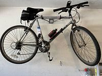Full side view of bicycle hung on wall