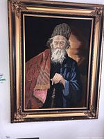 Full view of framed velvet painting depicting bearded man
