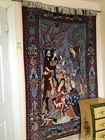 Full view of tapestry hung on wall with fringe and optional rod visible