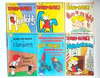 Six Dennis the Menace Bonus Magazine Series comic books from the 1970s laid out, each with unique, colorful covers.