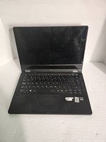 Front view of Lenovo IdeaPad Yoga 11S laptop open, keyboard and screen visible, screen off.