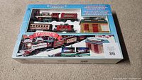 Vintage Dickensville Christmas Train Set in original box on carpet