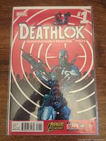 Front cover of Deathlok #1 Marvel comic book showing Deathlok character in cyborg form on a red and white target background, with 'Avengers Now' logo and barcode visible.
