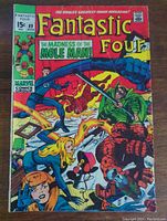 Front cover of Fantastic Four #89 comic book showing superheroes in action with title and price visible.
