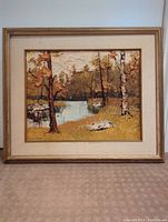 Full frontal image of textured landscape oil painting of a river scene with trees and rocks, framed in wood and linen mat.